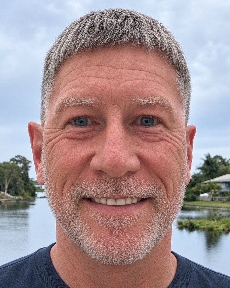 Nicholas Lockhart beside the lake, October 2026